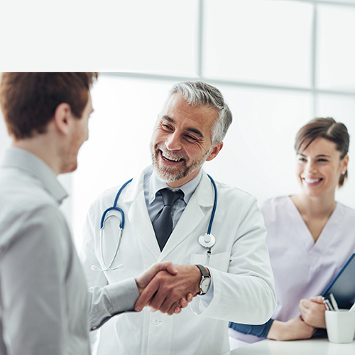 Doctor shaking hands with a patient during an appointment